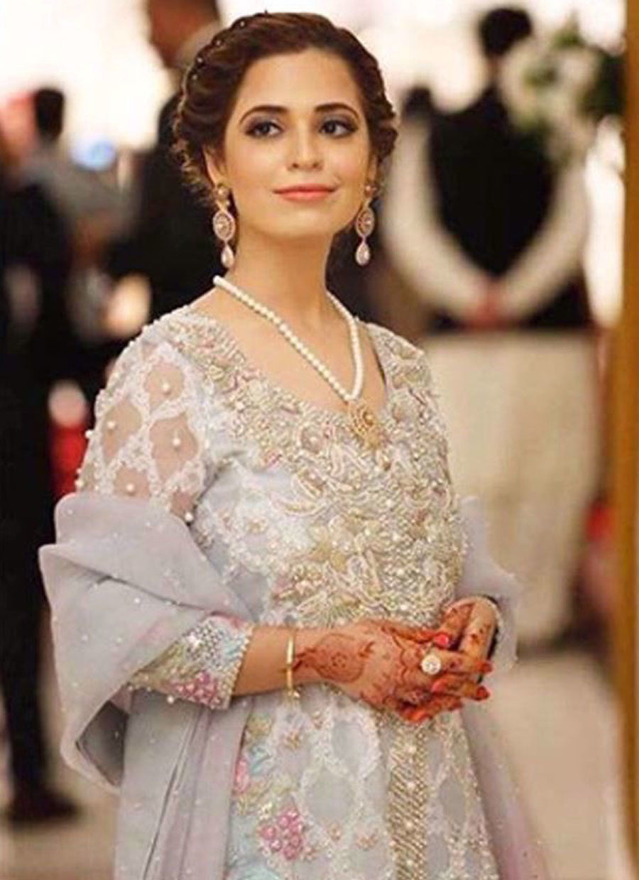 Shimmering ice blue with hints of golds and florals