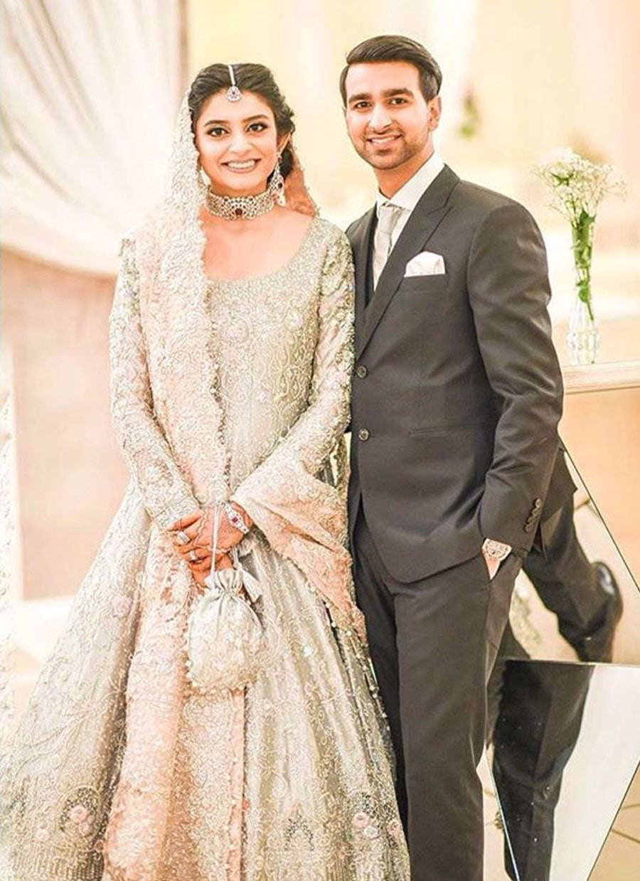 Mariam on her wedding reception in an aqua and blush pink Farah Talib Aziz bridal
