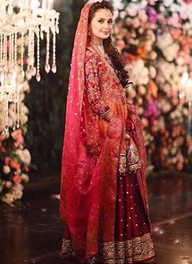 Absolutely gorgeous in a kalidaar Farah Talib Aziz angarkha in regal shades of burnt orange and magenta pink